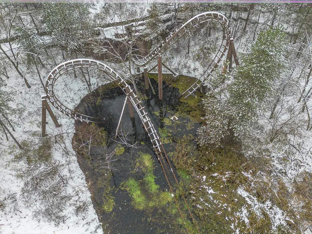 Dragon Mountain Roller Coaster Partially Submerged at Marineland, Niagara Falls
Alt Text: Dragon Mountain roller coaster track partially submerged in water at Marineland, Ontario
Description: A wide shot of Dragon Mountain, Marineland’s abandoned roller coaster, showing its partially submerged track in water, rusting supports, and surrounding overgrowth in Niagara Falls, Ontario. Perfect example of abandoned amusement park exploration and urban decay photography.