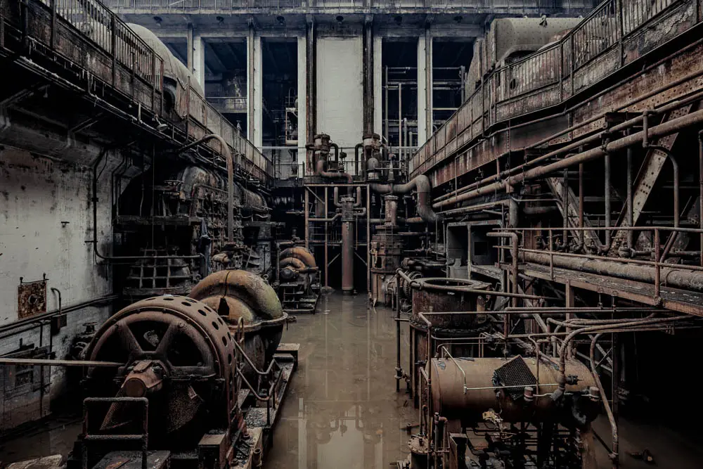 Standing inside this massive abandoned power plant in the United States, rusting turbines, corroded pipes, and stagnant water tell the story of a once powerful industrial giant now left to decay. The symmetry of the machinery and the eerie stillness of the flooded floor create a haunting reminder of how quickly even the largest engineering achievements can be forgotten.